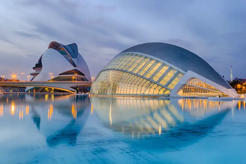 Futuristic arts complex reflected in water