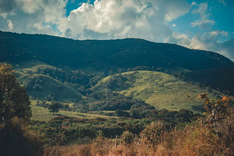Green hills under a cloudy sky
