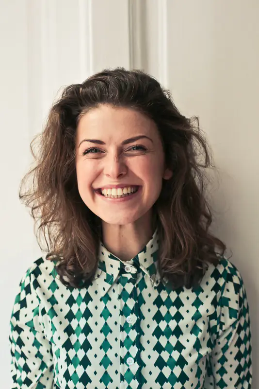 Laughing woman with curly hair