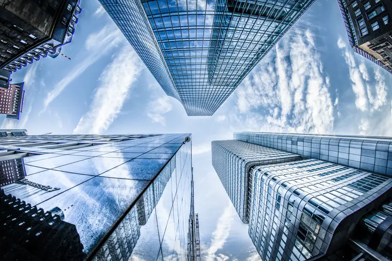 Looking up between glass towers