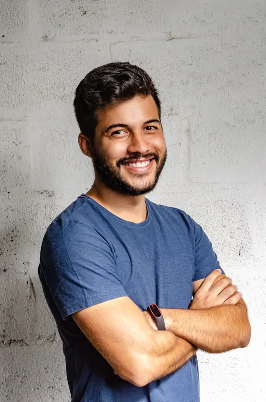Man with crossed arms smiling