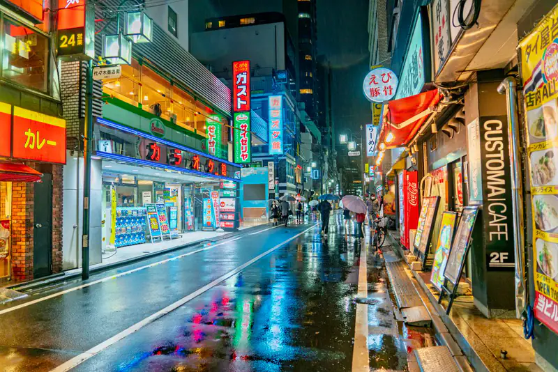 Neon reflections on wet street