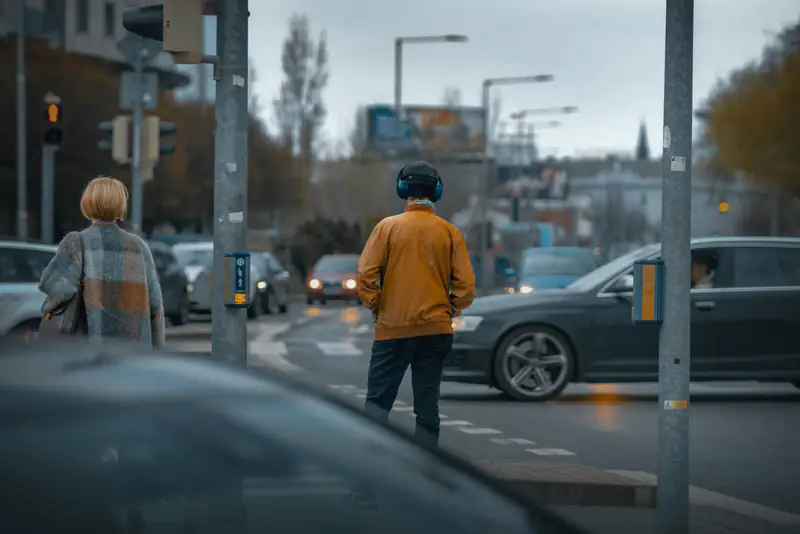Pedestrians crossing in autumn