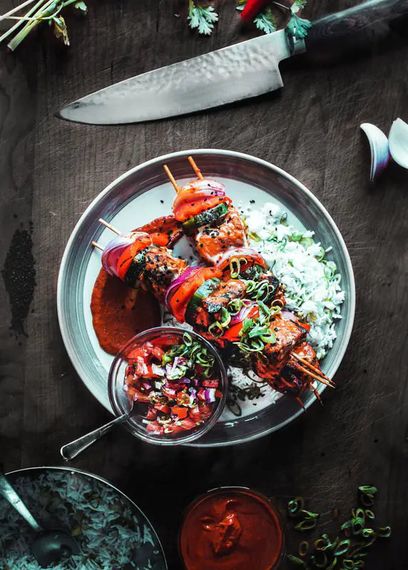 Skewers on a dark plate