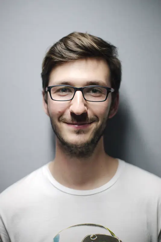 Smiling man with glasses