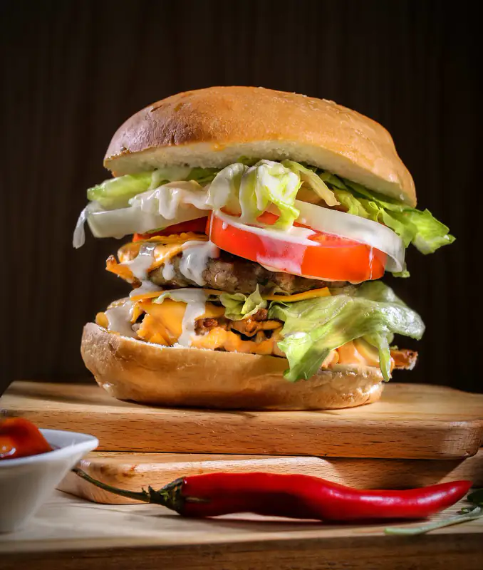 Tall burger on wooden board