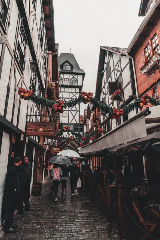 Umbrellas in a narrow lane