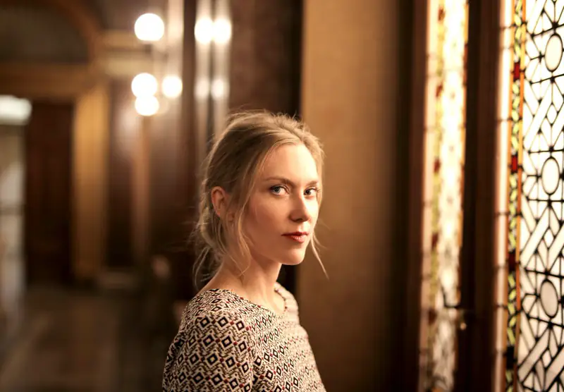 Woman in warm hallway light